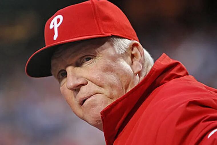 Charlie Manuel watched the Phillies suffer their fourth loss in five games against the Mets. (David M Warren/Staff Photographer)
