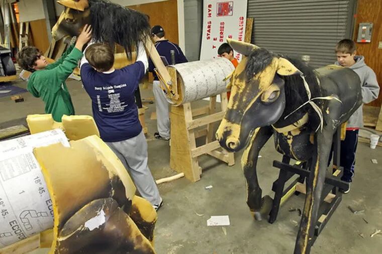 Shooting Stars members work on props Thursday for their Mummers theme this year, &quot;Lord of the Rings.&quot;