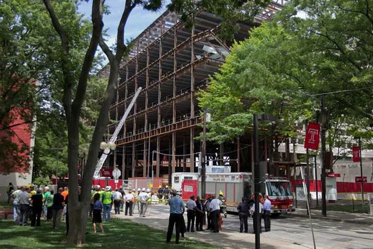 Philadelphia fire department was called to the site of an under construction steel framed building on the campus of Temple University at 12th and Berks that partially collapsed on Thursday afternoon July 11, 2013. ( ALEJANDRO A. ALVAREZ / STAFF PHOTOGRAPHER )