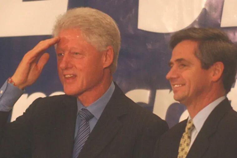 Former President Bill Clinton saluting during an October 2006 rally for Joe Sestak during the Democrat's successful campaign for Congress. They were at Valley Forge Military Academy. (Bob Williams / Staff Photographer)