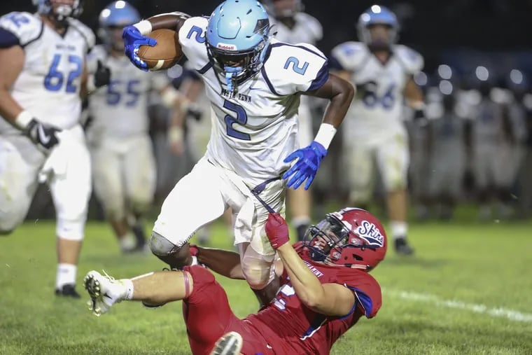 North Penn's Jon Haynes (2) is stopped by Neshaminy's Dawson Obringer (2) in the Knights' 34-33 victory on Aug. 24.