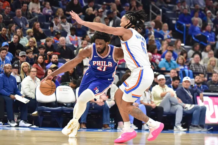 Sixers center Joel Embiid (21) drives past Oklahoma City Thunder forward Jaylin Williams in the first half on Saturday. Embiid finished with a game-high 35 points.