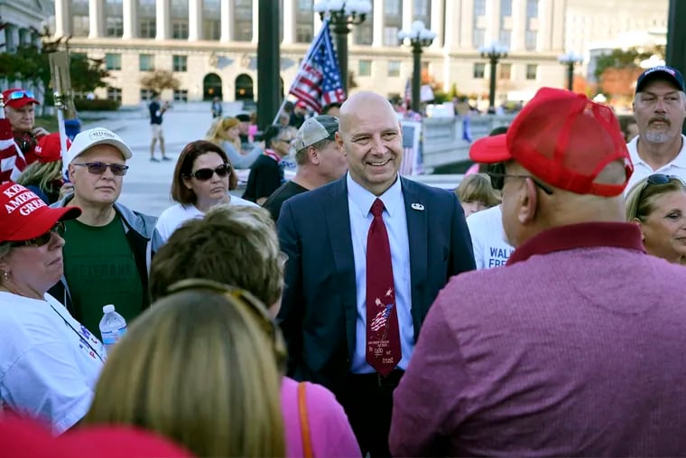 Pennsylvania state Sen. Doug Mastriano, R-Franklin, center, speaks to supporters of President Donald Trump as they demonstrate outside the Pennsylvania State Capitol, Saturday, Nov. 7, 2020, in Harrisburg, Pa., after Democrat Joe Biden defeated Trump to become 46th president of the United States. (AP Photo/Julio Cortez)