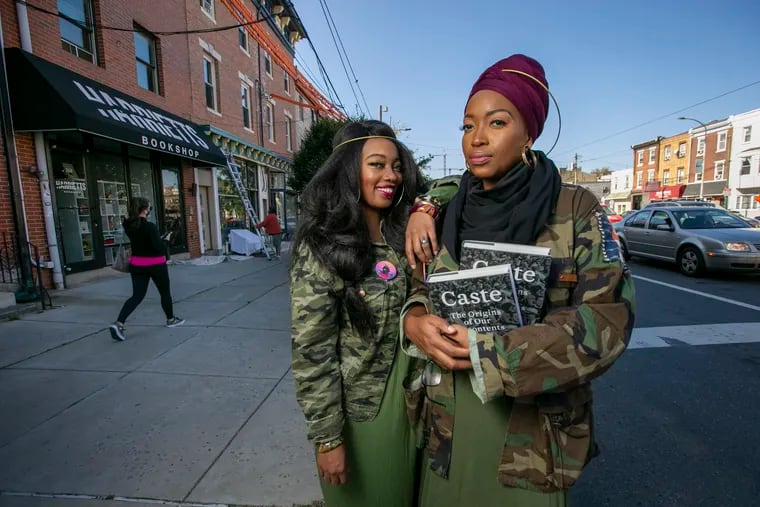 Jeannine A. Cook, owner of Harriett's Bookshop (right) and sister Jasmaine A. Cook will be hosting a sit-in demonstration to promote community and safety outside her bookstore, located at 258 E. Girard Ave. in Fishtown.
