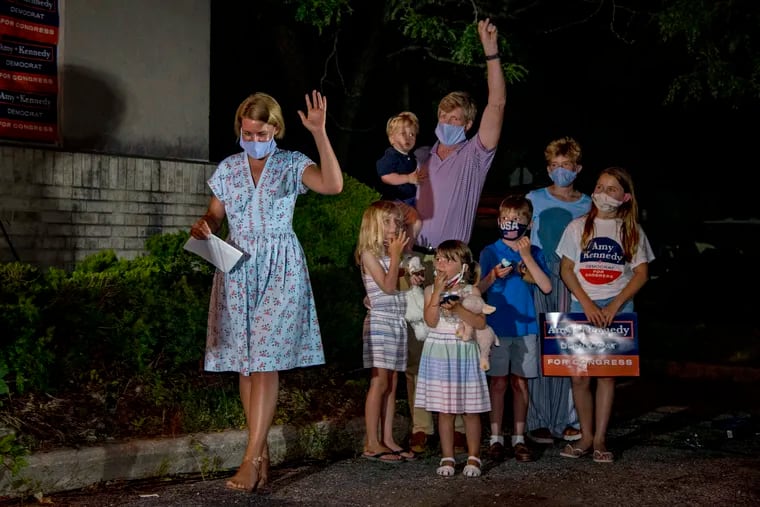 Amy Kennedy acknowledges fans, with the support of her husband, Patrick, and their six children, before declaring victory in New Jersey’s 2nd Congressional District Democratic primary on Tuesday night.