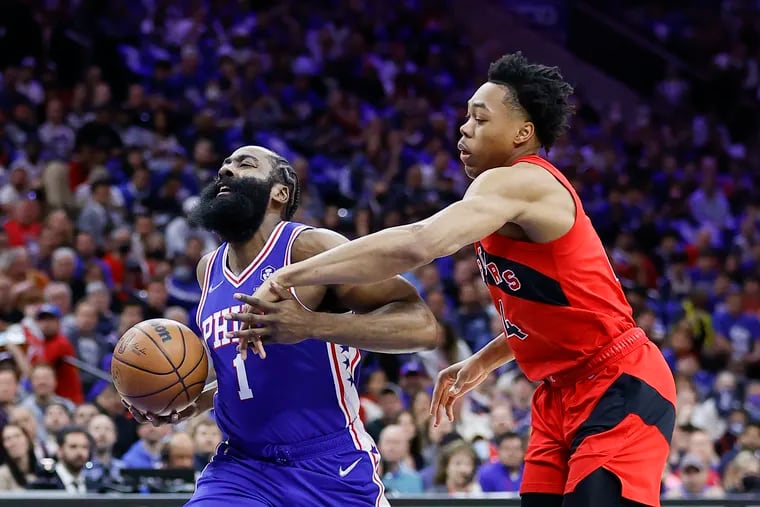Sixers guard James Harden drives to the basket against Toronto Raptors forward Scottie Barnes in the first quarter during game one of the Eastern Conference quarterfinals on Saturday, April 16, 2022 in Philadelphia.