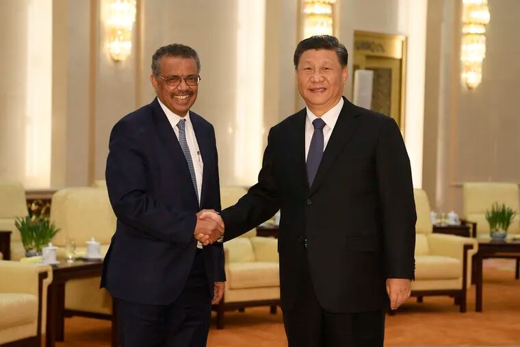 Tedros Adhanom Ghebreyesus, director general of the World Health Organization, left, shakes hands with Chinese President Xi Jinping before a January meeting at the Great Hall of the People in Beijing.