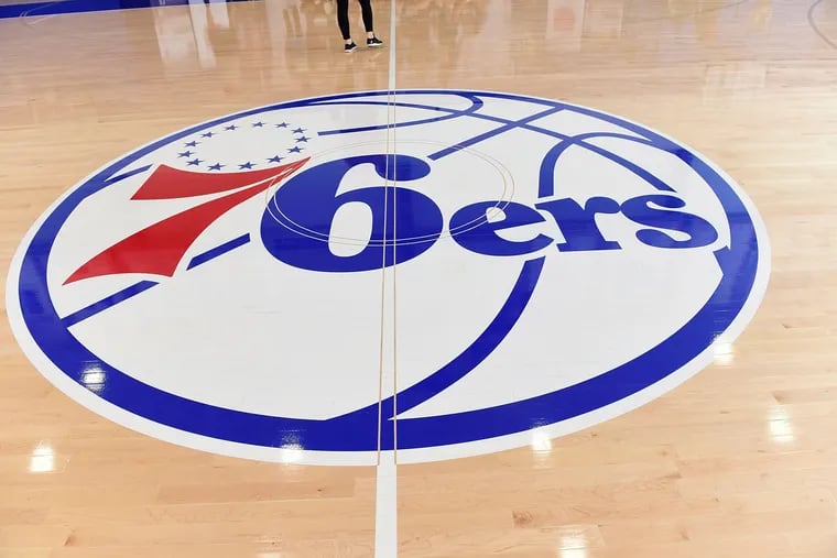 Philadelphia 76ers logo on the practice floor at Sixers Training Complex in Camden, New Jersey.