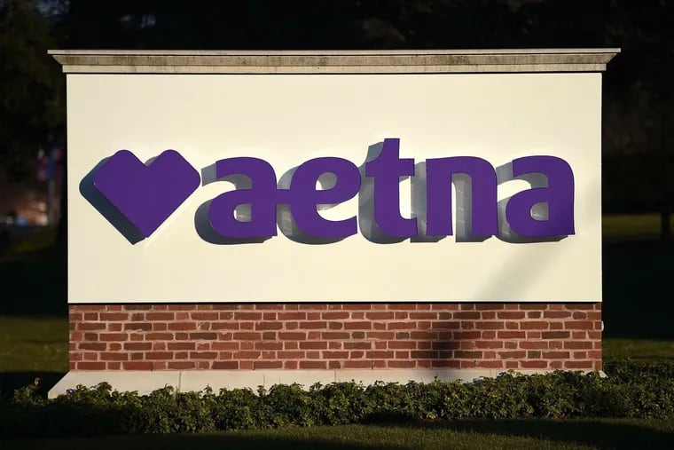 The 157 employees to be laid off work at the Aetna office in Blue Bell.