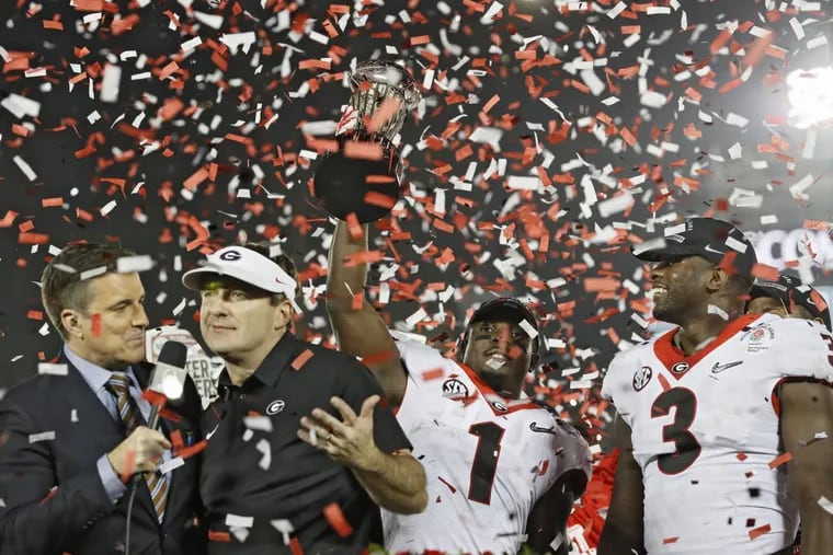 Georgia players and coaches celebrate their Rose Bowl victory, which sent them into Monday’s national championship game against Alabama.