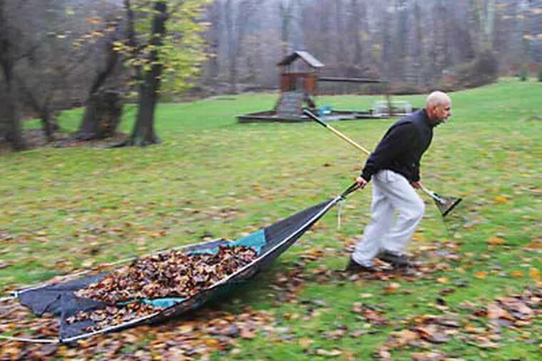 The Leaf Lugger is demonstrated by inventor Steve Costello. While dragging leaves on a tarp, the lawyer was annoyed by the bunched up corners. (Michael S. Wirtz / Staff Photographer)