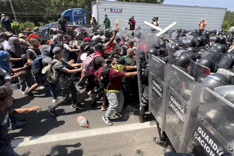 Migrant break through a line of National Guards trying to block them from leaving Tapachula, Mexico.