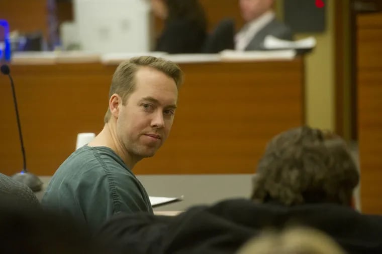 In a file photo from his January 2016 sentencing hearing, James Stuart, a former Deptford police officer who fatally shot a friend, looked back at his supporters in a Woodbury, Gloucester County, courtroom.