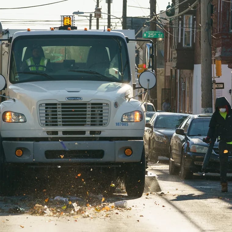 A street sweeping crew works near at 24th and York in 2019.