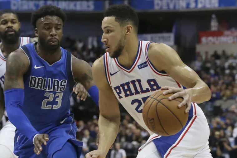 Sixers guard Ben Simmons (right) drives against the Mavericks’ Wesley Matthews in Dallas on Saturday, Oct. 28, 2017.