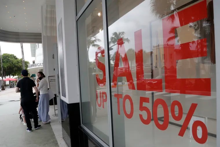 A sign advertises a sale at an H&M store in Miami Beach, Fla.