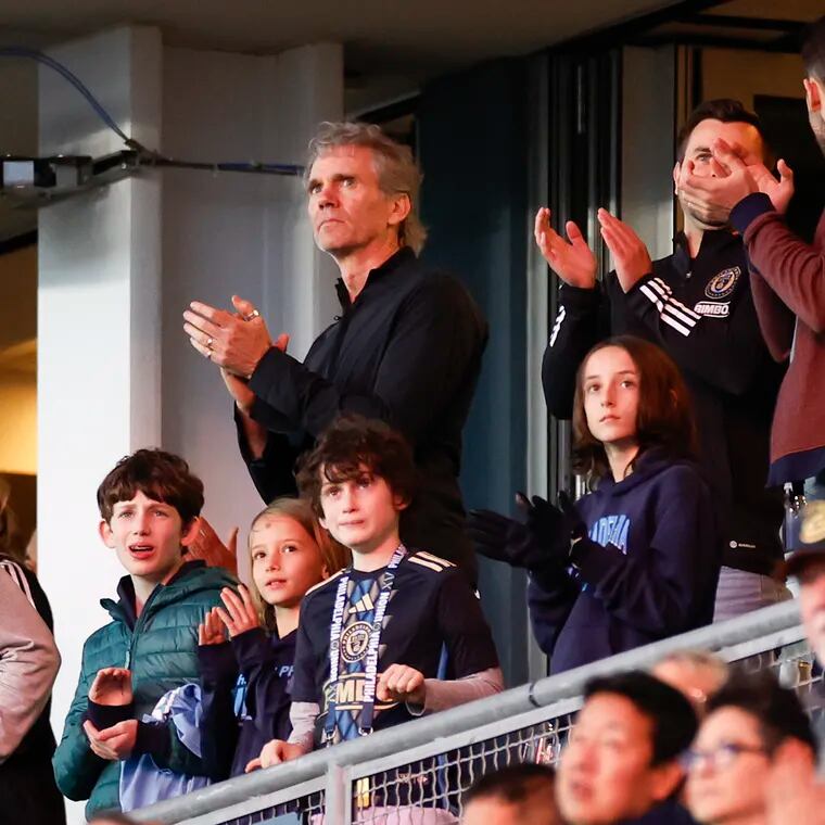 Union owner Jay Sugarman (center) applauds the team from his suite at Subaru Park during a recent game.