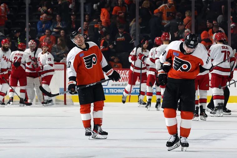 PHILADELPHIA, PENNSYLVANIA - OCTOBER 30: Bobby Brink #10 of the Philadelphia Flyers and Cam Atkinson #89 of the Philadelphia Flyers react after a loss to the Carolina Hurricanes at the Wells Fargo Center on October 30, 2023 in Philadelphia, Pennsylvania. (Photo by Tim Nwachukwu/Getty Images)