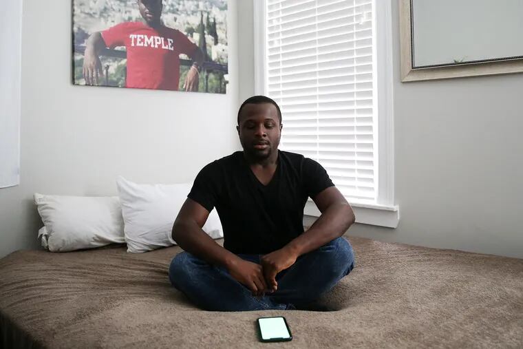 Ewan Johnson sits for a portrait at his home in West Philadelphia on Tuesday, Oct. 8, 2019. Johnson uses a mindfulness app called Tide.