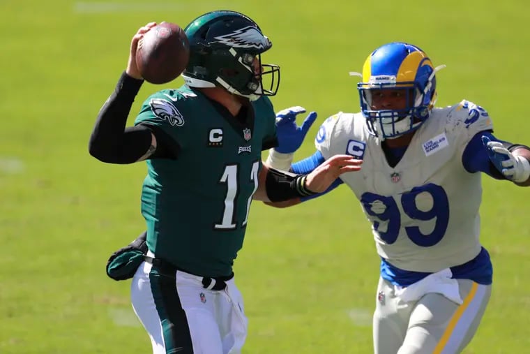 Los Angeles Rams defensive end Aaron Donald in pursuit of Eagles quarterback Carson Wentz Sunday, September 20, 2020.