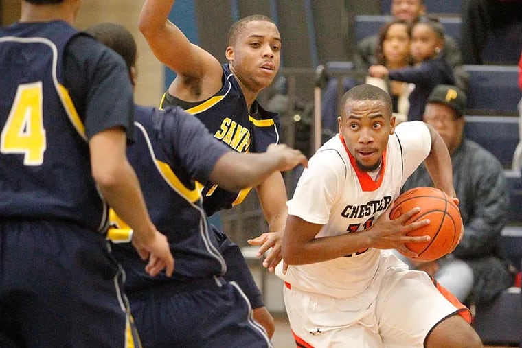Chester's Conrad Chambers tries to drive to the basket during the second quarter against Sanford.