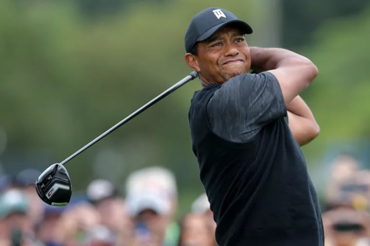 Tiger Woods tees off at the 10th hole of the BMW Championship on Saturday.