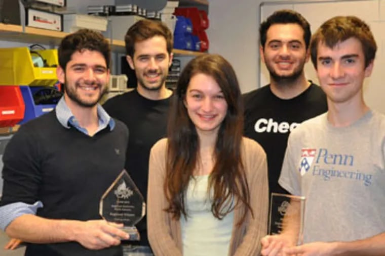 From left, Danny Cabrera, Josh Tycko, Danielle Fields, Mahamad Charawi, and Brad Kaptur display trophies for North America grand prize and best experimental measurement approach.