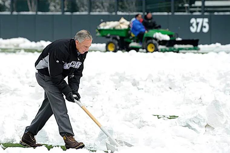 The game between the Atlanta Braves and the Colorado Rockies in Denver Monday night was postponed by a snowstorm. (Jack Dempsey/AP)