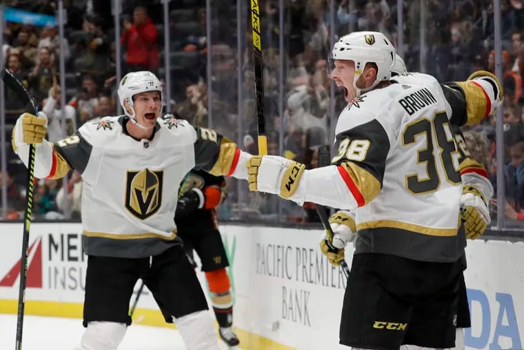 Vegas Golden Knights center Patrick Brown, right, celebrates with defenseman Nick Holden, left, after scoring during the first period of an NHL hockey game against the Anaheim Ducks in Anaheim, Calif., Sunday, Feb. 23, 2020. (AP Photo/Chris Carlson)