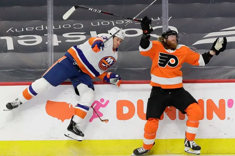Islanders left wing Matt Martin commits a holding penalty on Flyers right wing Jakub Voracek.