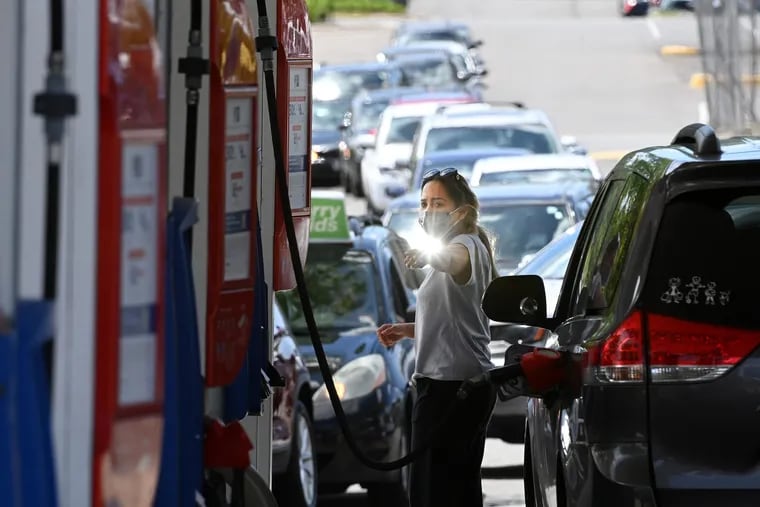 After a cyber hack of the Colonial Pipeline led to gas shortages, people waited in long lines at an Exxon station on May 12, 2021, in Springfield, Va. The FBI seized the $2.3 million in bitcoin ransom that Colonial Pipeline paid to hackers who infiltrated the company’s computer network.  Washington Post photo by Matt McClain