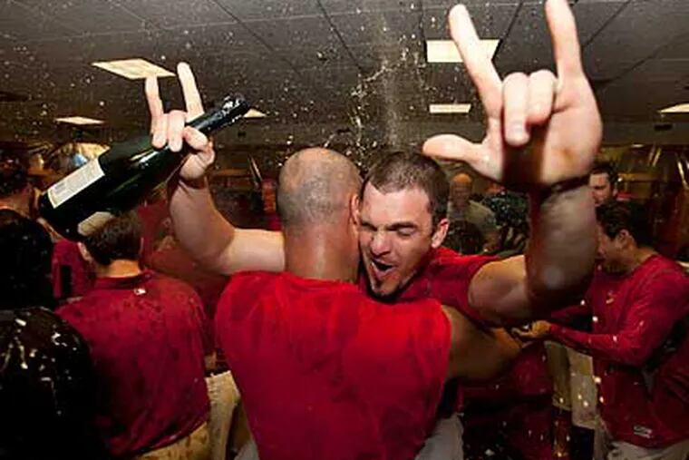 Ryan Theriot and the Cardinals celebrate clinching the NL Wild Card. (David J. Phillip/AP)