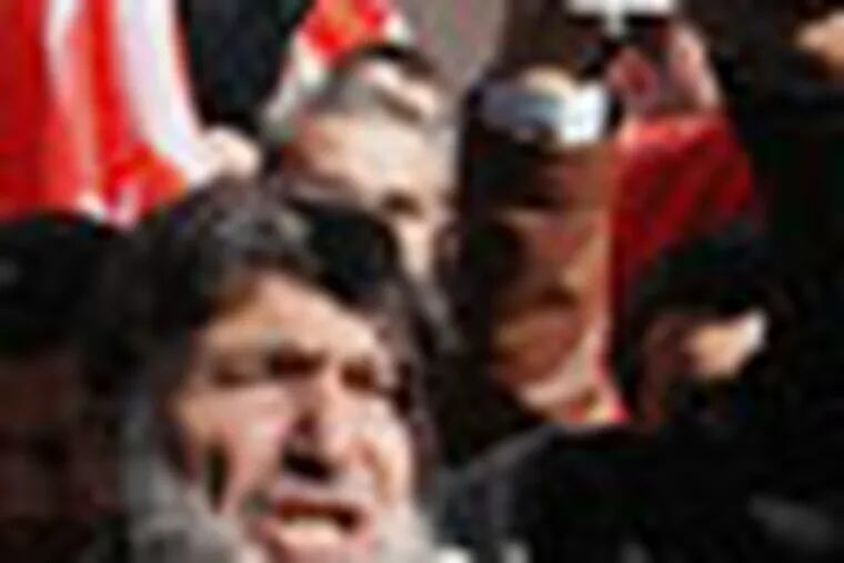 Hundreds of Syrians living in Turkey and human right activists shout anti-Assad slogans as they stage a protest outside the Syrian consulate to condemn the latest killings by Syrian regime in Syria, in Istanbul, Turkey, Sunday, Feb. 5, 2012. (AP Photo)