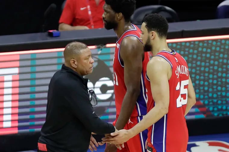 Sixers Head Coach Doc Rivers greets players center Joel Embiid and guard Ben Simmons after the Sixers lost to the Atlanta Hawks 128-124 in Game 1 of the NBA Eastern Conference playoff semifinals on Sunday, June 6, 2021.