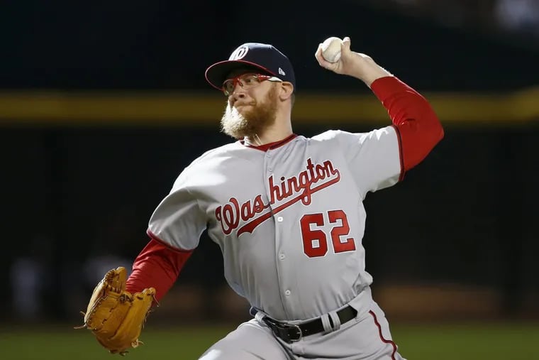 Washington Nationals' Sean Doolittle throws a pitch against the Arizona Diamondbacks during the ninth inning of a baseball game Sunday, July 23, 2017, in Phoenix. The Nationals defeated the Diamondbacks 6-2. (AP Photo/Ross D. Franklin)