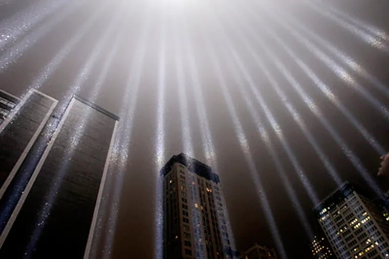 A test of the Tribute in Light rises above Lower Manhattan. The tribute, sponsored by the Municipal Art Society, will light up the sky Sunday night. (Seth Wenig / Associated Press)