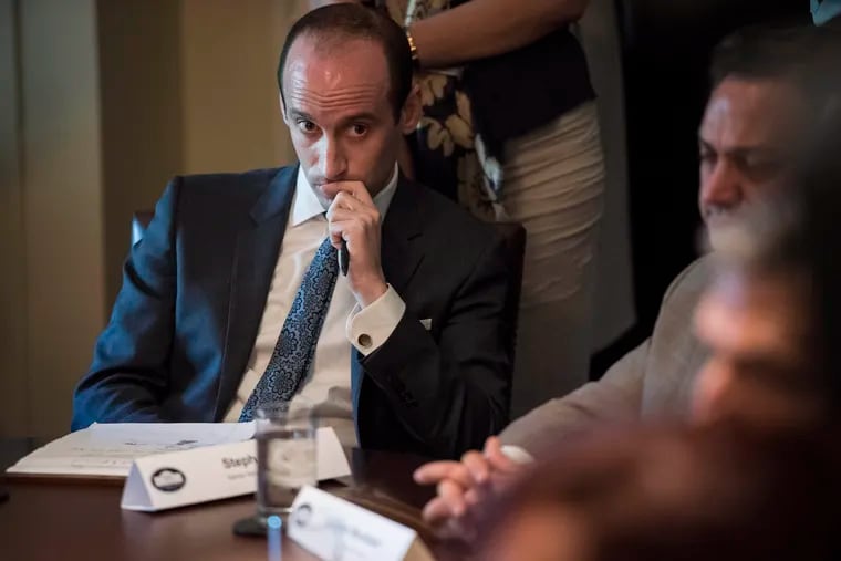 White House adviser Stephen Miller listens as he and President Donald Trump meet with "immigration crime victims" at the White House in June 2017.