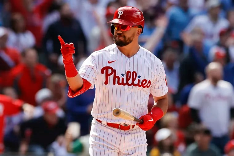 Phillies Kyle Schwarber points into the Phillies dugout after hitting a first inning solo home run against the Oakland Athletics on Friday, April 8, 2022 in Philadelphia.