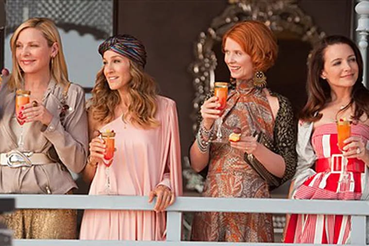 From left, Kim Cattrall, Sarah Jessica Parker, Cynthia Nixon and Kristin Davis are shown in a scene from "Sex and the City." (AP Photo/Warner Bros., Craig Blankenhorn)