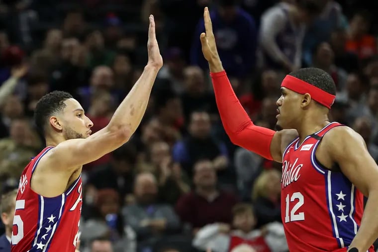 Sixers guard Ben Simmons (25) celebrates with Tobias Harris an and-one call this season.