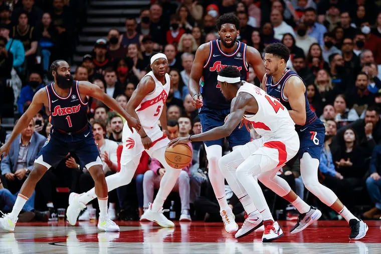 Sixers forward Tobias Harris, center Joel Embiid and guard James Harden defend Toronto Raptors forward Pascal Siakam during game three of the first-round Eastern Conference playoffs on Wednesday, April 20, 2022 in Toronto.