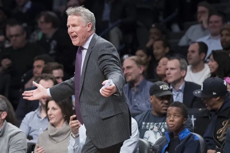 Sixers coach Brett Brown gestures during the first half of an NBA basketball game against the Brooklyn Nets, Wednesday, Jan. 31, 2018, in New York.