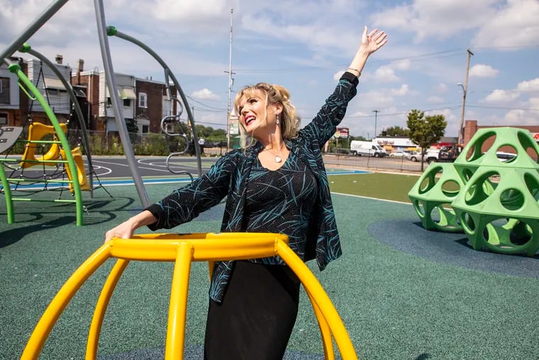 Teacher Susan Love takes a whirl in the playground at John Patterson Elementary School, where she is entering her ninth year. Love, a former foster child and advocate for kids in foster care, said, "Teaching allows you to be innovative in the classroom. But the big thing is the relationships with my students, because those relationships impact their futures forever."
