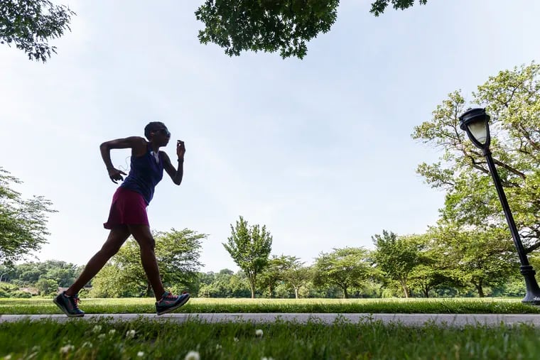 An eary morning powerwalker took advantage of the the sunny skies on Sunday in Fairmount Park. Severe thunderstorms and high winds are forecast for the later part of Fathers Day, so people were out early in Fairmount Park to enjoy the blue skies earlier in the day.