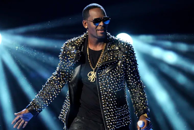 FILE - In this June 30, 2013 file photo, R. Kelly performs at the BET Awards in Los Angeles. A Georgia man involved with a recent documentary detailing abuse allegations against R. Kelly told police the singer's manager threatened him. A Stockbridge police report says Timothy Savage told an officer on Jan. 3 that Don Russell had texted him saying it would be best for him and his family if the documentary didn't air. Savage said he and his wife were involved with Lifetime's "Surviving R. Kelly" series. (Photo by Frank Micelotta/Invision/AP, File)