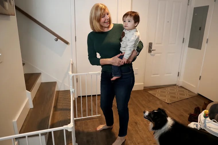 Sandy Cavanaugh has taken safety measures, such as a gate around the stairs, for grandson, Colt, whom she cares for regularly in her Center City Philadelphia townhouse.
