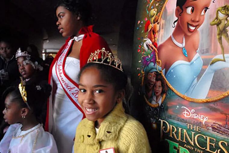 Princesses all: At the Bridge theater Saturday Delta Sigma Theta hosted a screening, and Shania Davis (center), 7, had her picture taken with “Miss Jabberwock 2009,” Amber Allen. (April Saul / Staff Photographer)