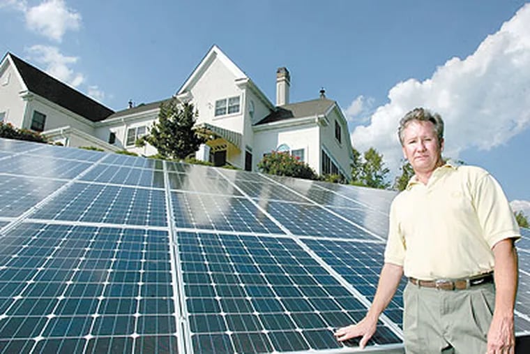Kennett Township resident Mark Lounsbury was stunned to learn the credit that helped convince him to recently install a $75,000 solar electric system is no longer available. He stands by the solar unit. (Charles Fox / Staff Photographer)