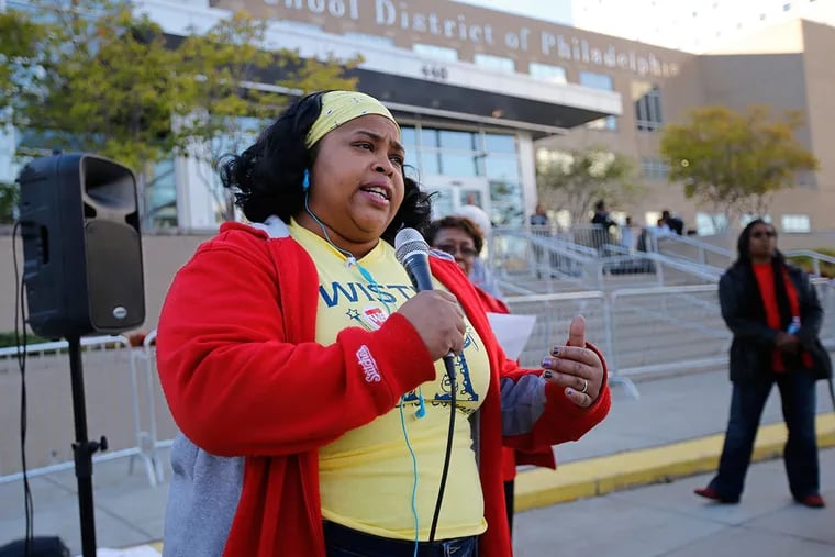 Kenya Nation, who has two children in Wister Elementary, speaks abut her frustration with the school system in front of the Philadelphia School District headquarters on Broad Street.