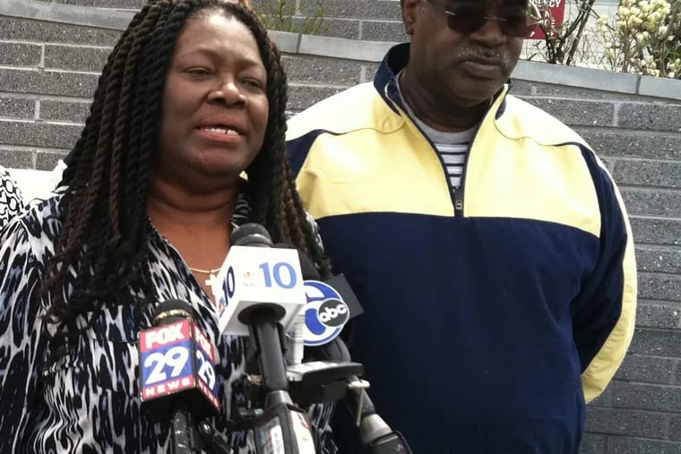Channabel Latham-Morris urges the driver who hit her son, Jamal Morris, at 45th and Market Streets about 3:45 a.m. Saturday to surrender to police. Morris' father, Hector Charlton Morris (right), said his son fell in love with Philadelphia.